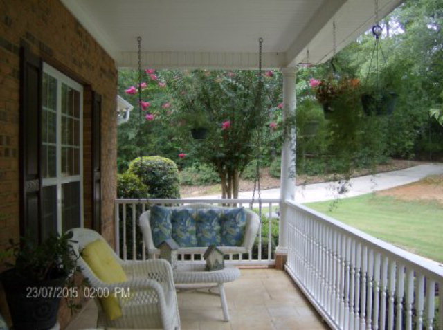 130 Riverbend Road Jackson, GA 30233 - Photo 4 of 29 a view of a chair and tables in the balcony