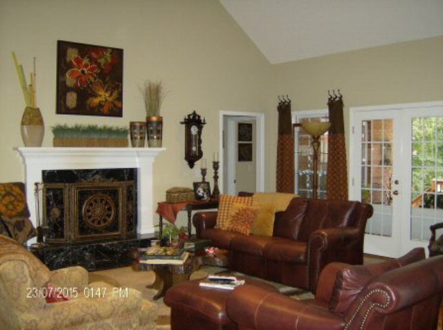 130 Riverbend Road Jackson, GA 30233 - Photo 7 of 29 a living room with furniture large window and a fireplace