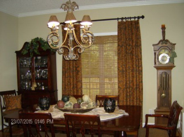 130 Riverbend Road Jackson, GA 30233 - Photo 8 of 29 a view of a dining room with furniture and chandelier