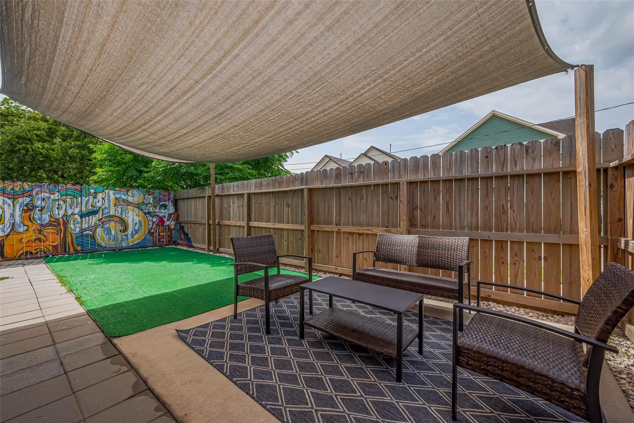 1902 Dan Street Houston, TX 77020 - Photo 36 of 43 Outside, enjoy a private corner lot with a lush turf yard, extra parking, and a 2-car garage—rare for this central location.