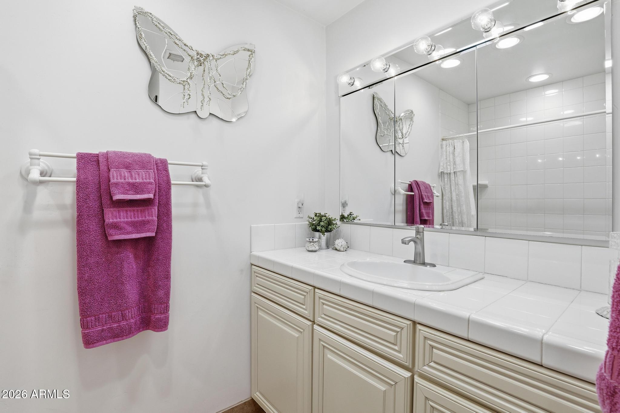 7736 West Gibson Ranch Road Payson, AZ 85541 - Photo 28 of 51 a bathroom with a sink and a mirror