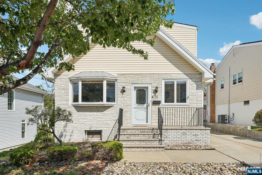 a view of a house with a yard and windows