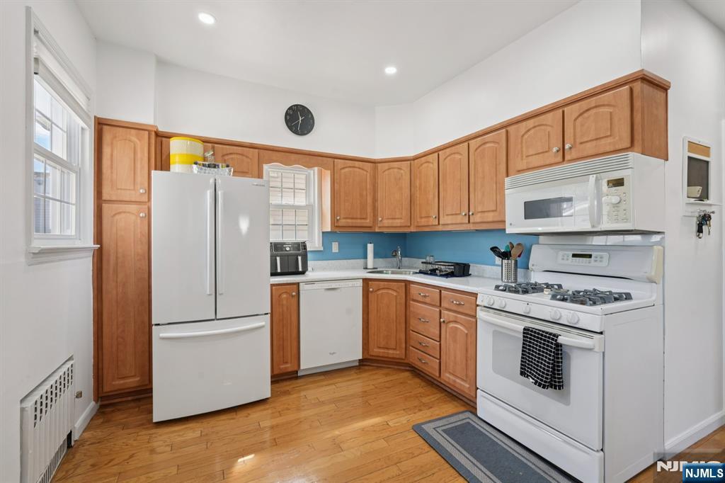471 Harding Avenue Lyndhurst, NJ 07071 - Photo 18 of 50 a kitchen with a white cabinets and white appliances