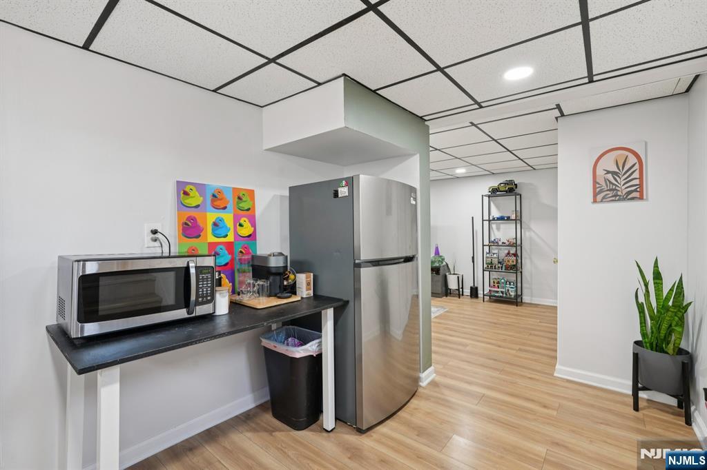 471 Harding Avenue Lyndhurst, NJ 07071 - Photo 27 of 50 a utility room with refrigerator and microwave