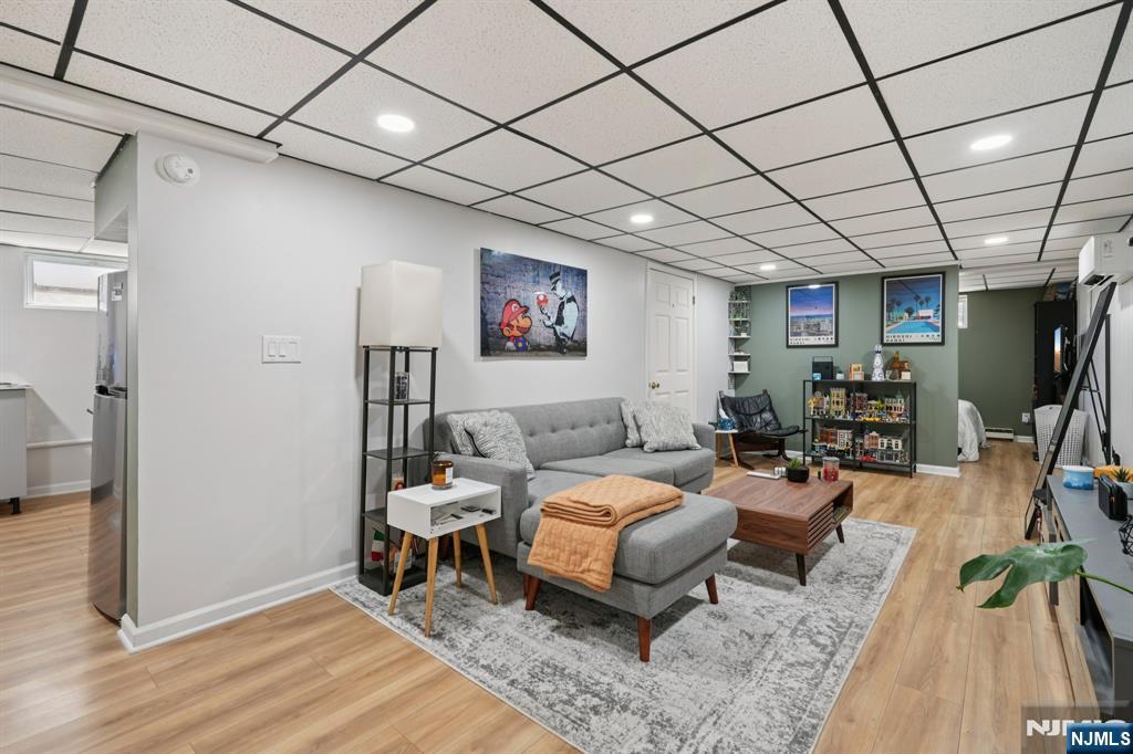 471 Harding Avenue Lyndhurst, NJ 07071 - Photo 28 of 50 a bedroom with furniture and a wooden floor