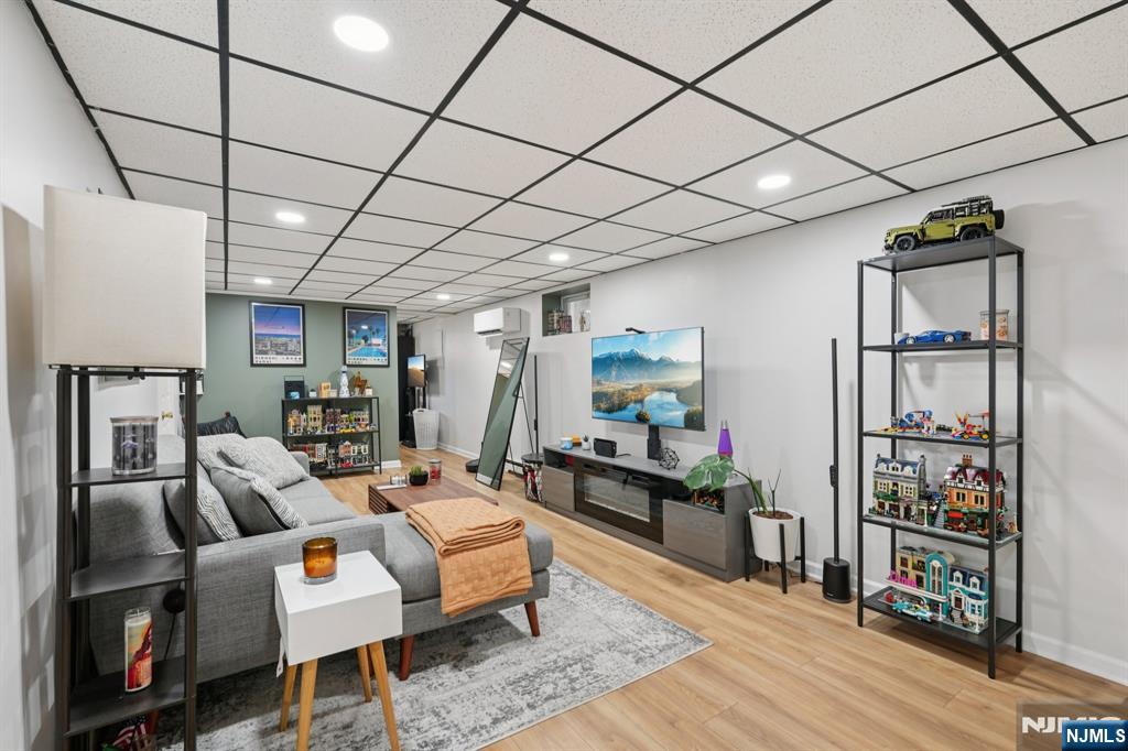 471 Harding Avenue Lyndhurst, NJ 07071 - Photo 29 of 50 a living room with furniture and a flat screen tv