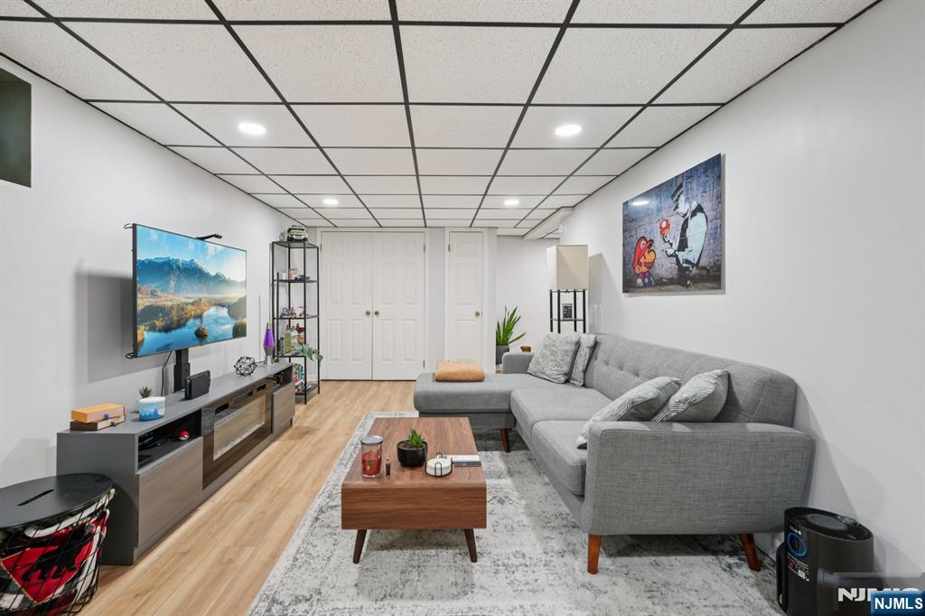 471 Harding Avenue Lyndhurst, NJ 07071 - Photo 31 of 50 a living room with furniture and a flat screen tv