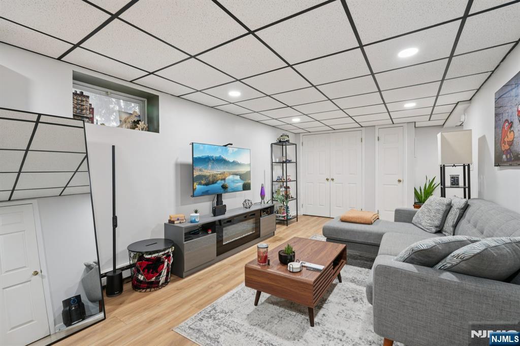 471 Harding Avenue Lyndhurst, NJ 07071 - Photo 32 of 50 a living room with furniture and a flat screen tv