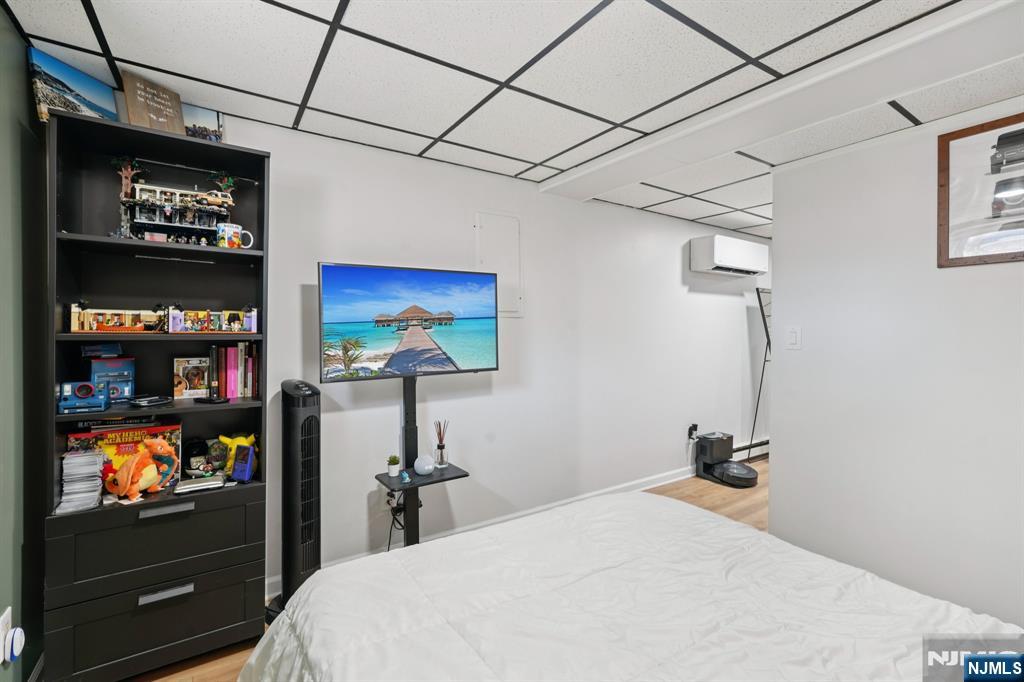 471 Harding Avenue Lyndhurst, NJ 07071 - Photo 34 of 50 a bedroom with a bed and a flat screen tv