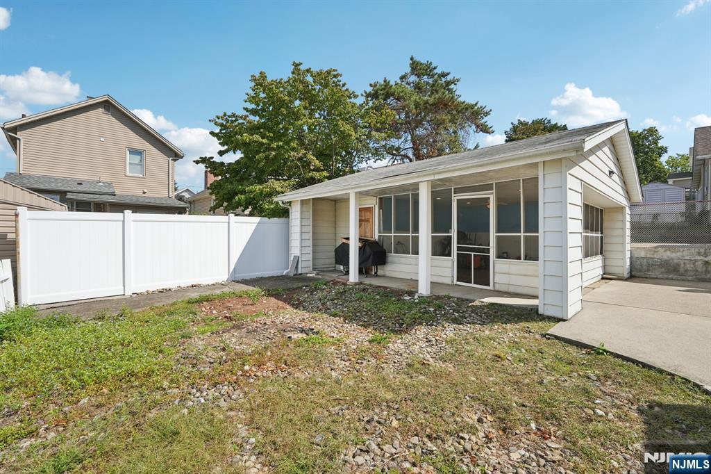 471 Harding Avenue Lyndhurst, NJ 07071 - Photo 5 of 50 a view of a house with a yard and potted plants