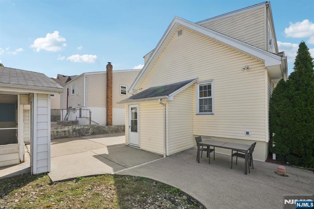471 Harding Avenue Lyndhurst, NJ 07071 - Photo 7 of 50 a view of a house with a patio