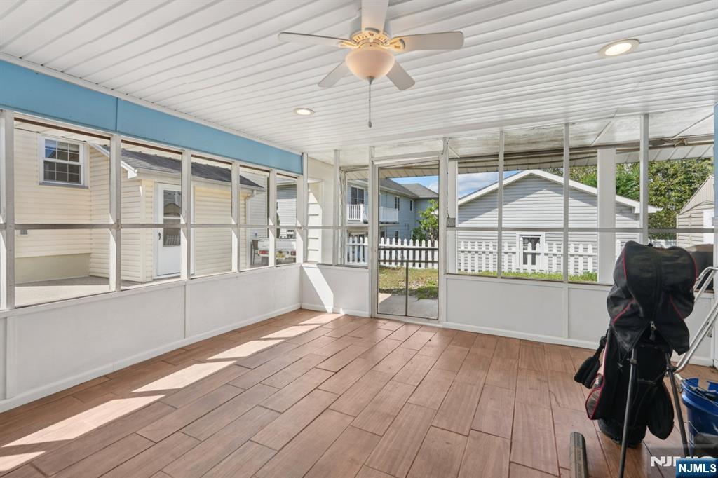 471 Harding Avenue Lyndhurst, NJ 07071 - Photo 8 of 50 a view of an empty room with wooden floor and windows