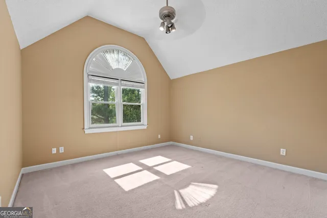 a bathroom with a double vanity sink a toilet and a mirror