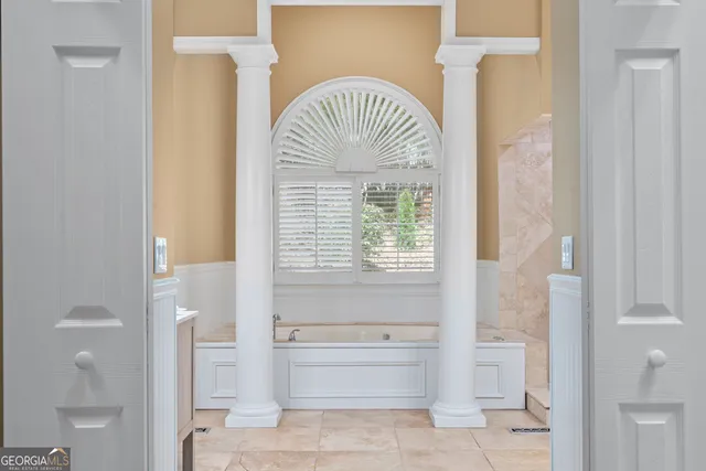 a bathroom with a bathtub and a shower