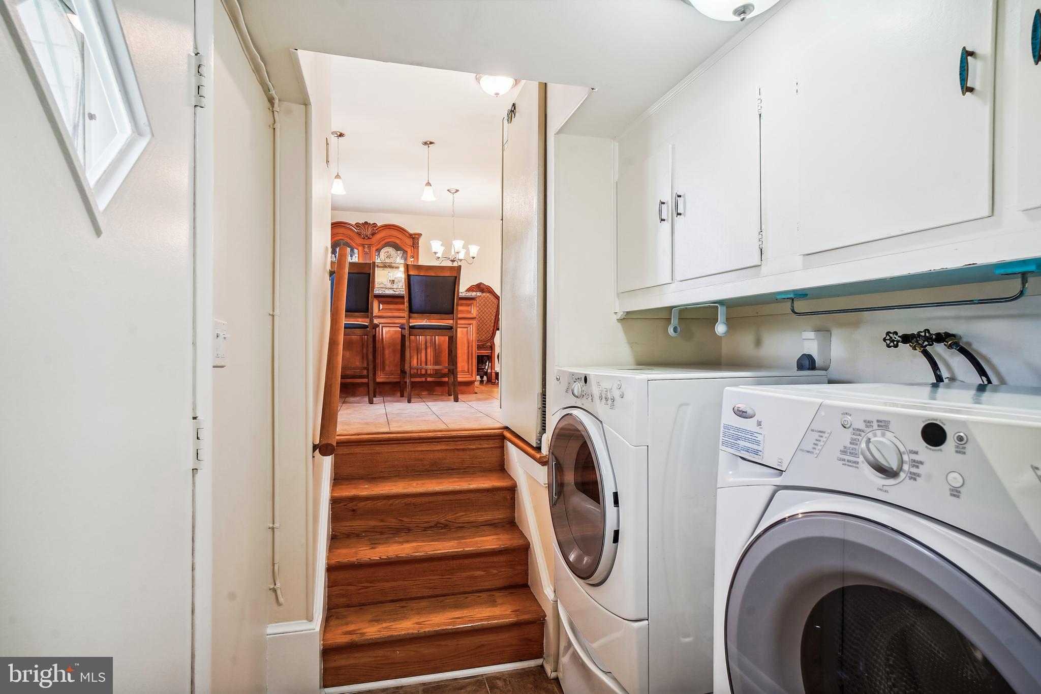 5405 Manorfield Road Rockville, MD 20853 - Photo 16 of 34 Stairs from kitchen to front load washer/dryer