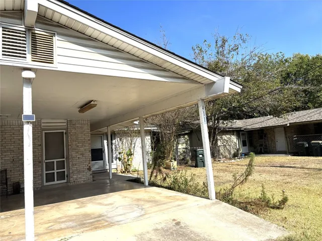a view of a patio with swimming pool table and chairs