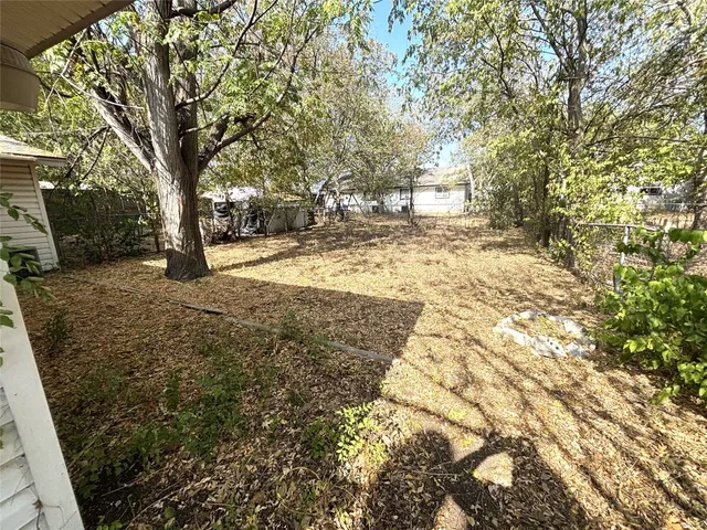 a view of yard with trees