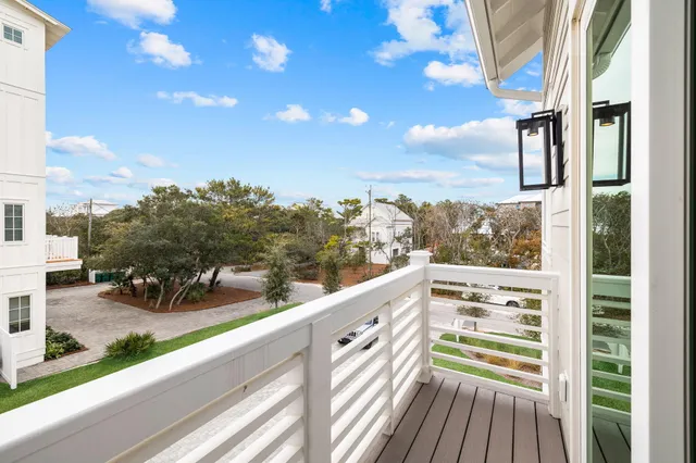 a swimming pool with yard in front of it