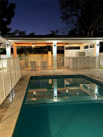 a view of a backyard with sitting area