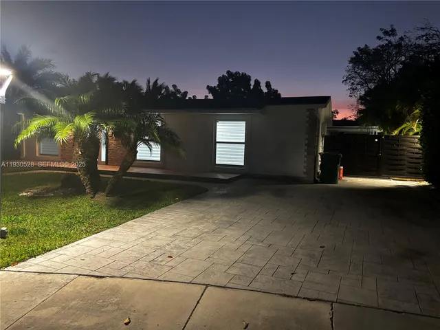 a view of an empty room with a fireplace