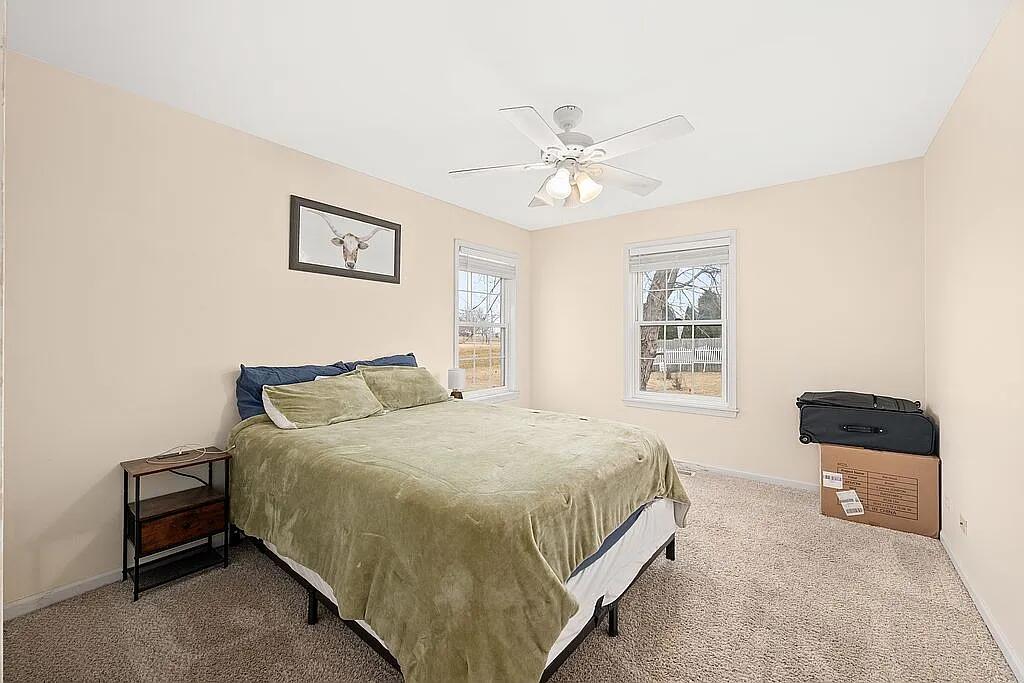 678 Elizabeth Street Maple Park, IL 60151 - Photo 12 of 18 a bedroom with a bed and a window