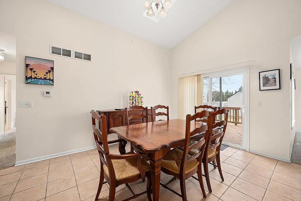 678 Elizabeth Street Maple Park, IL 60151 - Photo 7 of 18 a view of a dining room with furniture and wooden floor