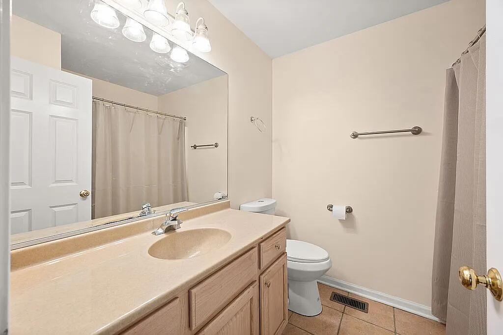 678 Elizabeth Street Maple Park, IL 60151 - Photo 9 of 18 a bathroom with a sink toilet double vanity and shower