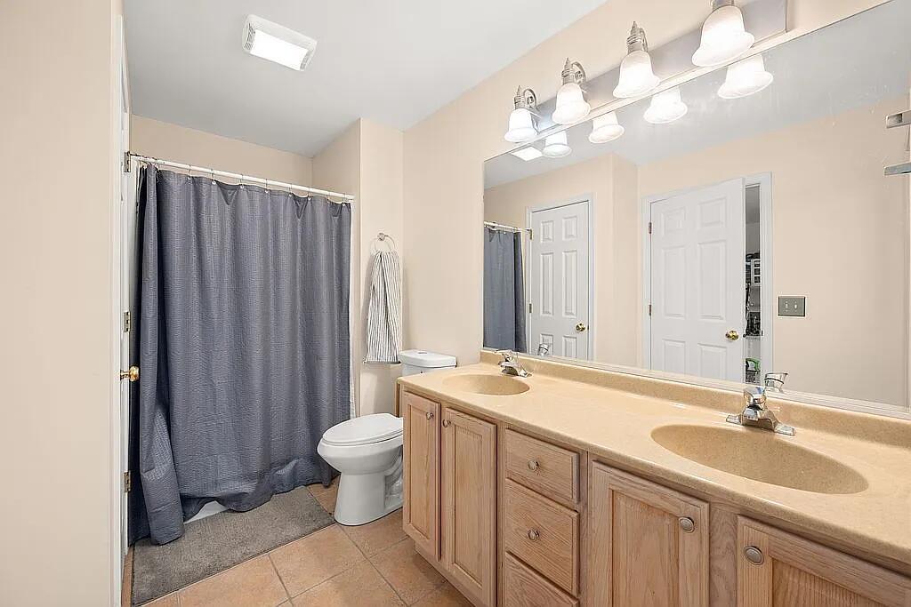 678 Elizabeth Street Maple Park, IL 60151 - Photo 10 of 18 a bathroom with a double vanity sink mirror and toilet