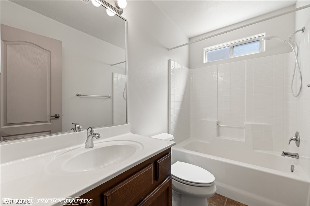 874 Glendale Road Mesquite, NV 89027 - Photo 47 of 71 A well-appointed bathroom offers a clean vanity, bright lighting, and a functional tub and shower combination.