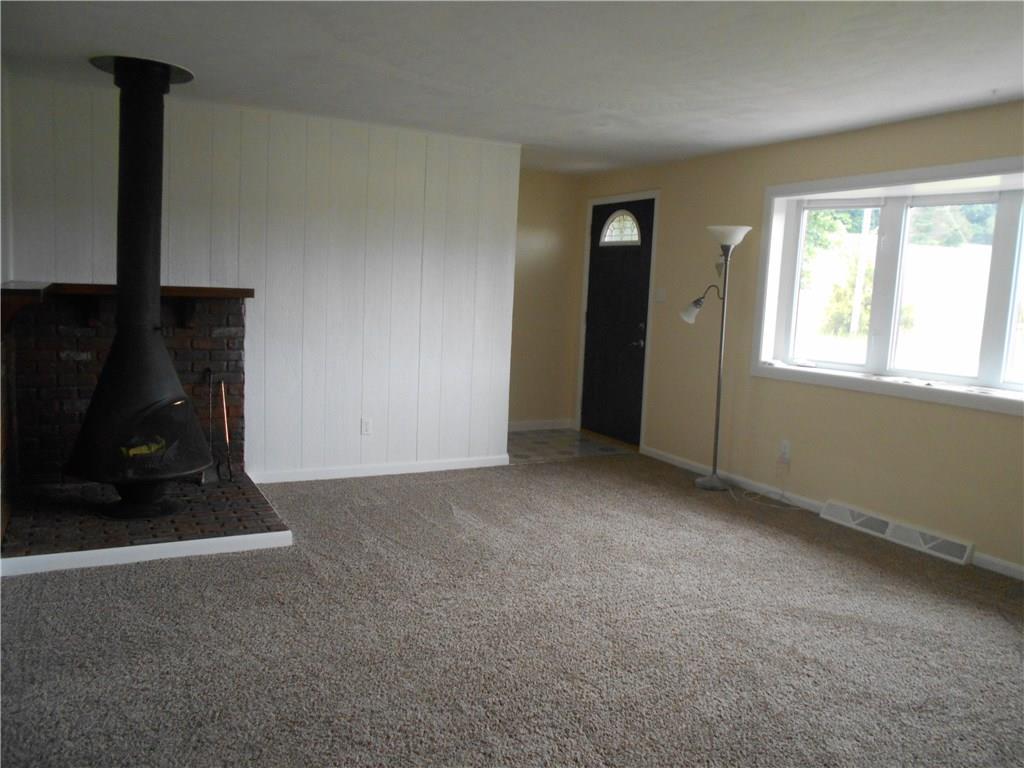133 Singleton Road Sarver, PA 16055 - Photo 5 of 20 Nice size living room with new carpet, wood burner and bay window.