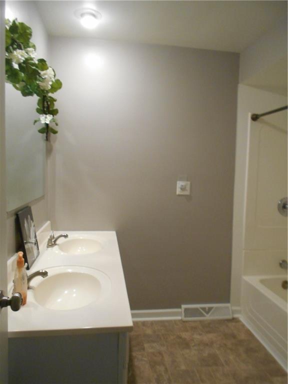 133 Singleton Road Sarver, PA 16055 - Photo 6 of 20 Full bath with double sink vanity.