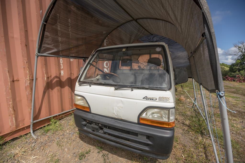 320 Hanauana Road Haiku, HI 96708 - Photo 19 of 33 a car parked in front of a house