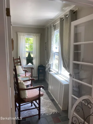 a workspace with furniture and a window