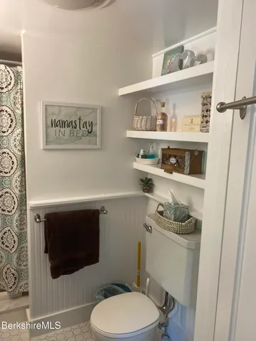 a bathroom with a shower curtain