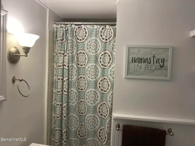 a view of a dining room with furniture and a window