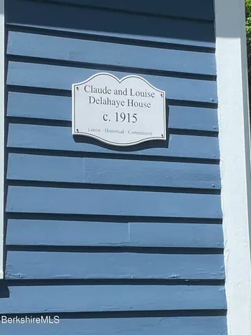 a view of a gate with a wooden door