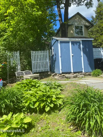 a view of a chairs and table in the balcony
