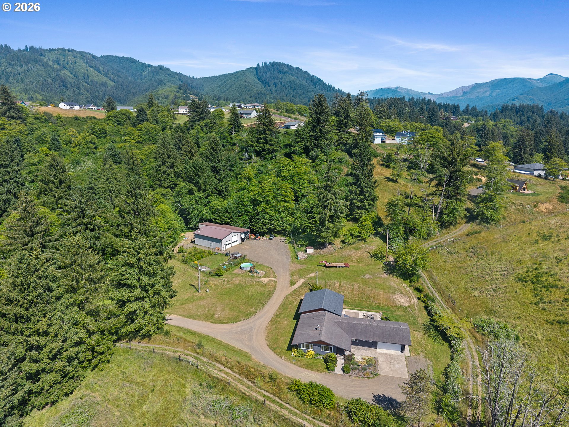 850 Hodgdon Road Tillamook, OR 97141 - Photo 40 of 43 an aerial view of residential houses with outdoor space and trees
