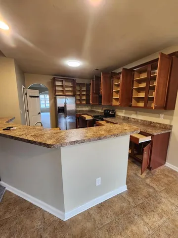 a view of storage and utility room with a sink