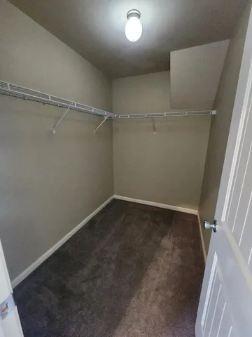 an empty room with a empty space and windows