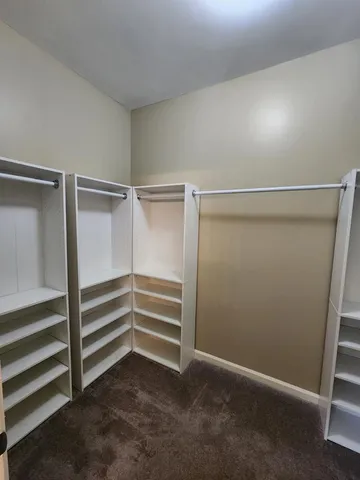 a spacious bathroom with a sink double vanity and a mirror
