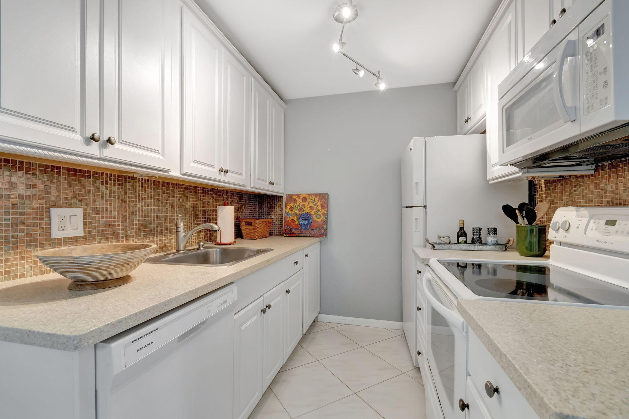 3031 Cornwall East Boca Raton, FL 33434 - Photo 8 of 84 a kitchen with a sink and cabinets