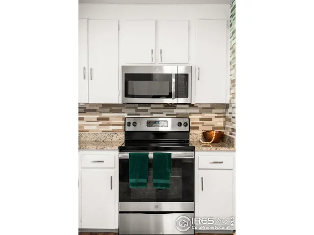 a kitchen with a stove and a microwave