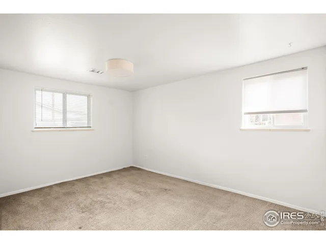 a bathroom with a sink a mirror and shower