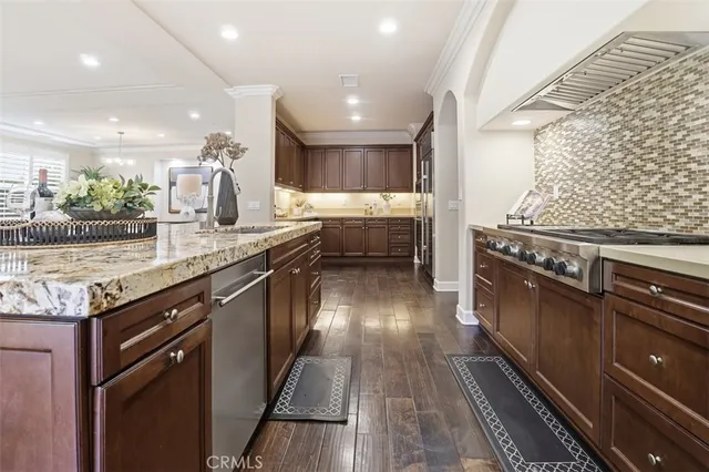a kitchen with a stove and a sink