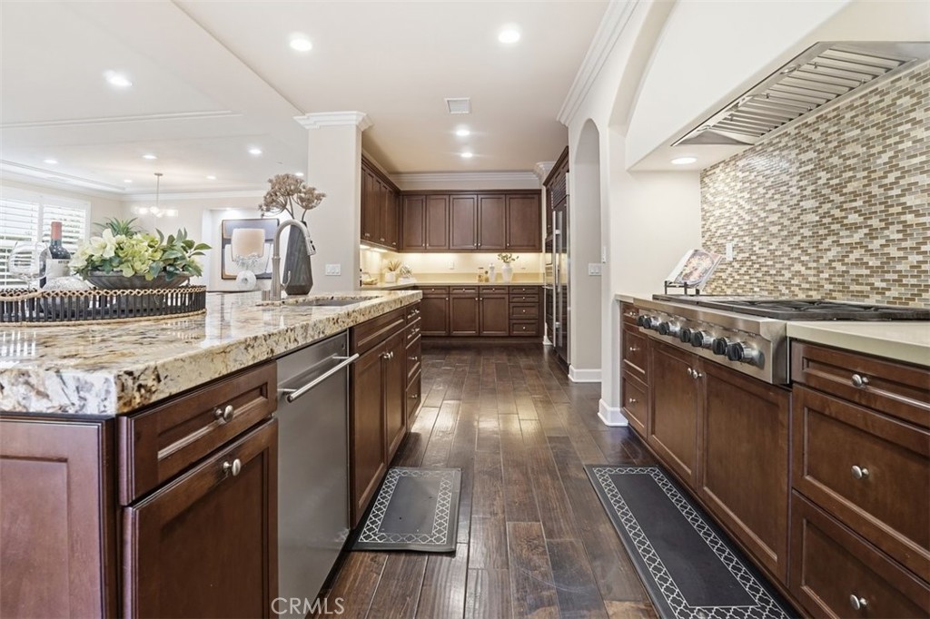 65 Rolling Green Irvine, CA 92620 - Photo 15 of 49 a kitchen with a stove and a sink