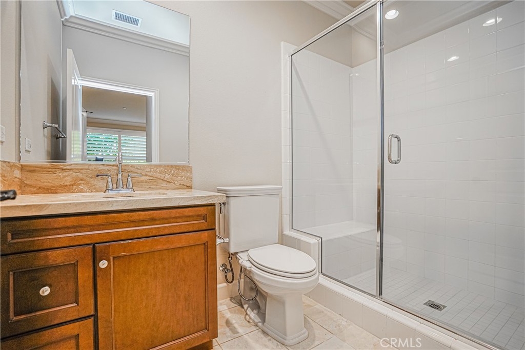 65 Rolling Green Irvine, CA 92620 - Photo 19 of 49 a bathroom with a toilet sink and shower