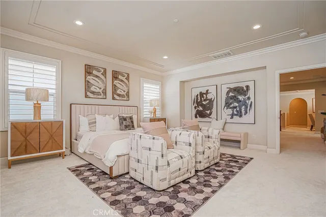 a bed room with furniture and paintings on the wall