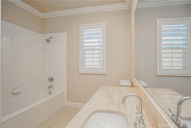 a spacious bathroom with a bathtub and shower