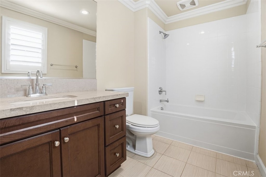 65 Rolling Green Irvine, CA 92620 - Photo 39 of 49 a bathroom with a sink a toilet and a bathtub